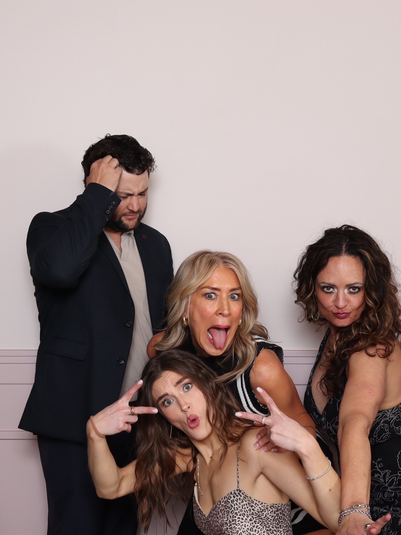 Guests laughing together during a photo booth session